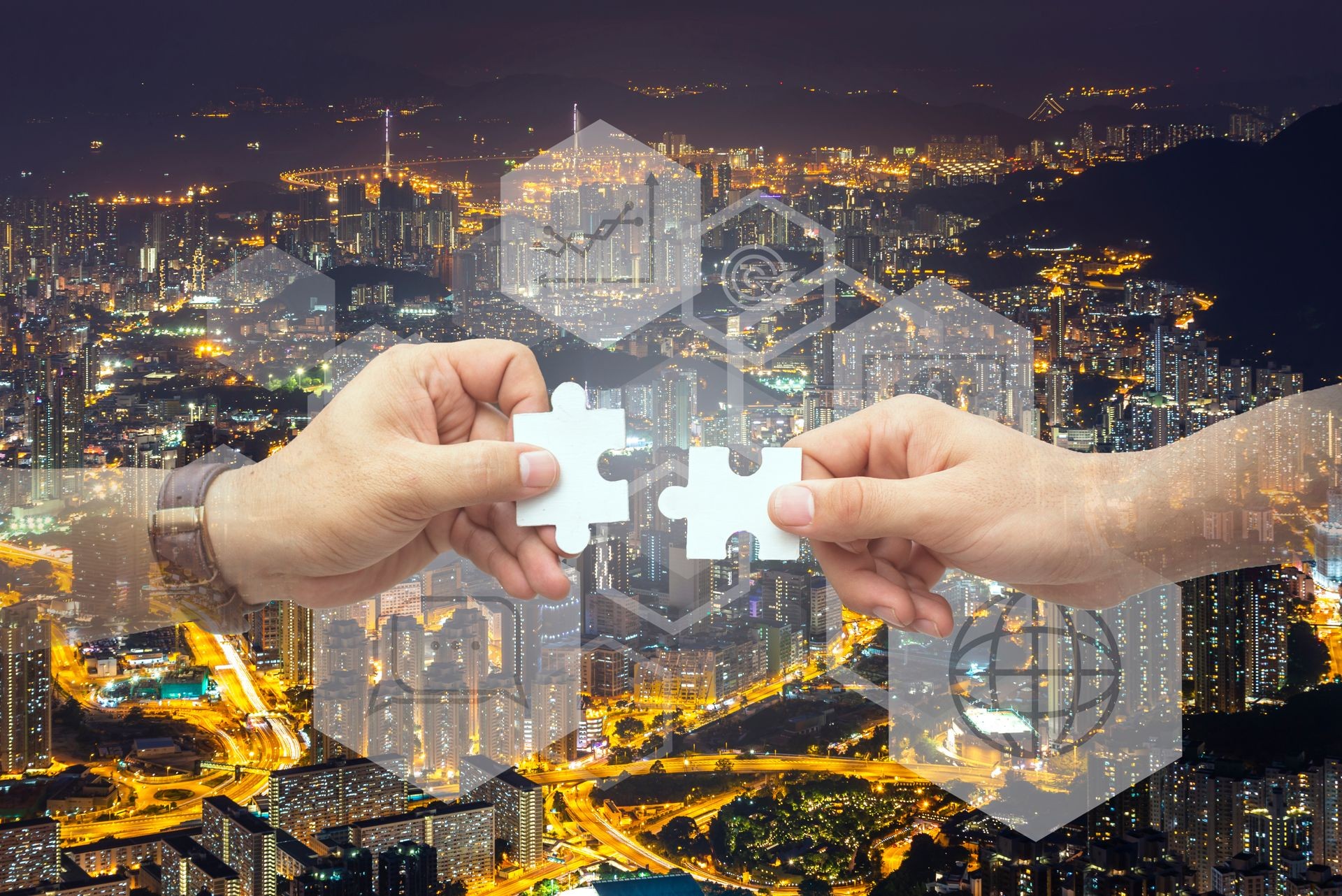 2 business hand with jigsaw puzzle, network solutions concept,with city background